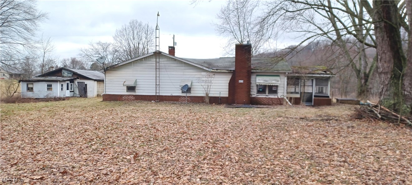Corner lot on almost 4 acres in Columbiana County!  Beautiful country setting.  This 1496 sq ft Ranch home has three bedrooms with a full and half bath.  Enclosed side and back porch.  Kitchen with skylight and breakfast bar.  Refrigerator, stove and dishwasher. Fireplace in the dining room.  Walk out basement.  Detached 1340 sq ft garage, and if you're handy with cars, one has a mechanic's bay.  There is also an in-ground pool and a pool house.  Several outbuildings on the property as well.  This is a fixer upper, but once you have it like you want it, you will never want to leave!