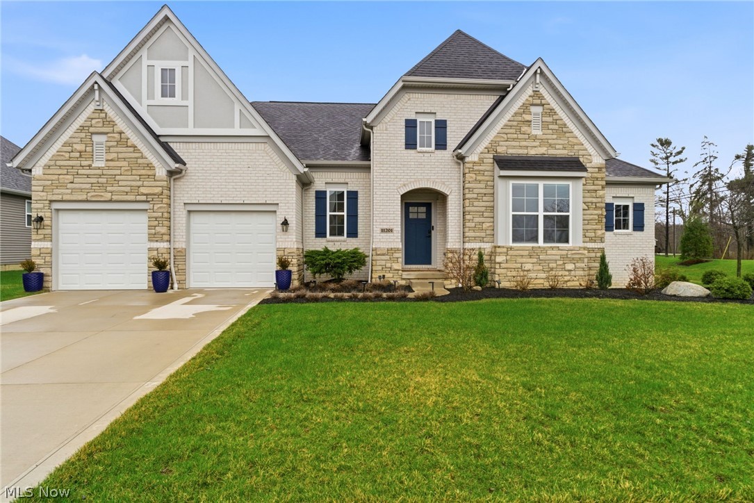 Welcome to 11201 Creek View Way in Columbia Station which is an exceptional newer ranch built in 2023 by Drees Homes, offering over 3,600 square feet of thoughtfully designed living space with high-end upgrades throughout.
The main level features over 2,300 square feet with 4 bedrooms and 3 full bathrooms, highlighted by 9’ ceilings throughout and vaulted ceilings in the main living area that create an open, airy feel. The kitchen serves as the centerpiece of the home, showcasing quartz countertops, a stunning waterfall island and upgraded KitchenAid appliances including the microwave, range, and oven. Modern finishes flow seamlessly into the living and dining spaces.
The primary suite offers a true retreat with a spacious layout, a beautifully appointed bathroom featuring a soaking tub and separate shower and a large walk-in closet complete with custom-built-in cabinetry. All three full bathrooms on the main level include quartz countertops, continuing the home’s consistent, high-quality design.
The finished lower level adds approximately 1,300 square feet of additional living space with 8’ ceilings, a custom dry bar, and two separate areas that can be utilized as a home office, study, or additional space for guests. A half bath is already in place and roughed in to be completed as a full bathroom along with an upgraded tankless hot water heater.
Outdoor living is just as impressive, with a covered back patio plus an additional 14’ poured patio wired for a future hot tub for entertainment.
Meticulously maintained and thoughtfully upgraded by the current owners, this home offers the benefits of new construction without the wait. The sale also includes transferable structural and waterproofing warranties providing additional peace of mind. Located in a desirable Columbia Station community with convenient access to local amenities, this is a rare opportunity you won’t want to miss. Schedule your private showing today.