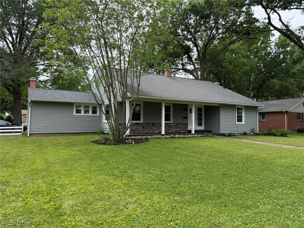 Lots of updates in this 4-6 bedroom, 3.5 bath stone and vinyl home.  Move in ready with fresh paint and updated flooring throughout.  New counters in the kitchen.  Brick gas fireplace in the dining room.  Main floor master bedroom with half bath.  New gas furnace and central air in 2025.  75% of windows are vinyl replacement.  Brand new carpet on the second floor.  Partially finished lower level includes rec room, game room and full bath with new flooring.  2 Car attached garage and 10 X 8 storage shed.  Nice Dover location in Reeves Heights, close to schools, hospital, fair grounds and even the YMCA.