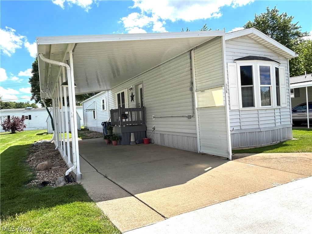 This beautiful 70 x 15, 2002 Shamrock mobile home is in Southern Terrace Mobile Home Park in Columbiana, a great 55+ community. The home features an open floor plan with large living room, dining area with crown molding, chair rail, vaulted ceiling, and galley style kitchen with stove, refrigerator, and microwave. Primary bedroom has a private bath.  There is an additional bedroom and second bathroom. Laundry room conveniently located near kitchen and includes washer and dryer. New carpeting, new furnace 2025. Newer hot water tank. Carport for convenient parking. 10x12 shed for extra storage. Buyer must be approved by park management. Current lot rent $472 per month, includes trash service. Make your appointment to view this home.