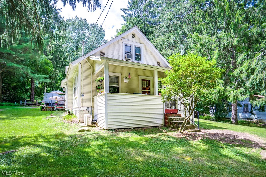Charming Cape Cod on 2.73 Acres with a Barn/outbulding with a Workshop & Endless Character on the interior of the home. Step inside to a welcoming entryway warmed by a wood-burning fireplace. Rich hardwood floors flow throughout much of the main level, complemented by curved walk-throughs that add to the home's charm. The nicely sized living room offers comfortable space to gather, while a versatile first-floor bedroom or office provides flexible living space. The dining area shines with an oversized window and custom built-ins. The heart of the home has been fully redone with newer cabinetry, wood-plank ceilings, beadboard walls, and a tiled backsplash. Butcher block countertops pair beautifully with a black stainless farmhouse sink and a breakfast bar. A convenient mudroom area off the kitchen leads to the back of the home. The first floor is rounded out by another bedroom and a full bath featuring a soaking tub with shower and a single vanity, with direct access to the first-floor bedroom. Hardwood stairs lead to a versatile flex space, perfect for a home office, playroom, or storage. Two additional bedrooms complete the second floor with ample closet space. The larger bedroom has an L-shaped layout, a wood-plank ceiling, and overhead lighting. The exterior features include a covered front porch, a covered back patio overlooking a fenced-in yard, and a two-car detached garage for parking and storage. Towards the back of the property, you'll find a Horse barn/outbuilding with a single stall and storage area
and a workshop on the back side of the barn, equipped with water and electricity. Don't miss this fantastic opportunity; schedule your showing today!