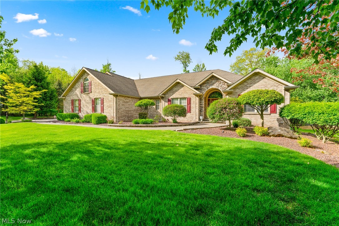 Amazing Ranch home in the heart of Boardman, yet peaceful and scenic with great outdoor spaces. As you enter the drive to the attached 4 car garage you will notice the private yard that borders Boardman Park property and there is even a creek that runs at the rear of the property. This open concept home features a large kitchen with granite counters, living room and dining room with cathedral ceilings and tons of natural light. The master suite has a trey ceiling, dual walk in closets and large en suite bath with soaking tub, water closet and dual granite vanities, also french doors that lead to private hot tub room and access to rear outdoor patio. The rest of the home has two bedrooms with jack and jill baths, an office/den, first floor laundry, half bath and finished bonus area above the 4 car garage. The basement could be an entire additional living suite, it has a large family room, kitchen, 2 bedrooms and a full bath. Updates include, HVAC, HWT, appliances, some flooring, the out