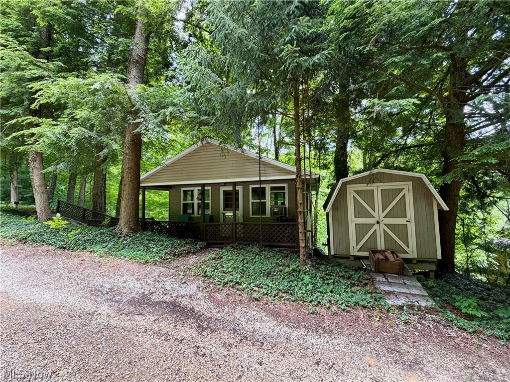 Move-In-Ready Leesville Lake Cottage. Quiet location with dock slips available. Potential for year-round living, short-term rental or weekend getaway. Affordable Lake living. Large, shaded exterior deck. 1 bedroom, 1 full bath, full kitchen and living room with wood stove. Owned private land, (2) 50’x100’ lots. Private water well and septic system. New roof in 2016. Serene walking path from the cabin to your boat dock, approximately 400 yds. Gravel parking area. Mobility ramp access.