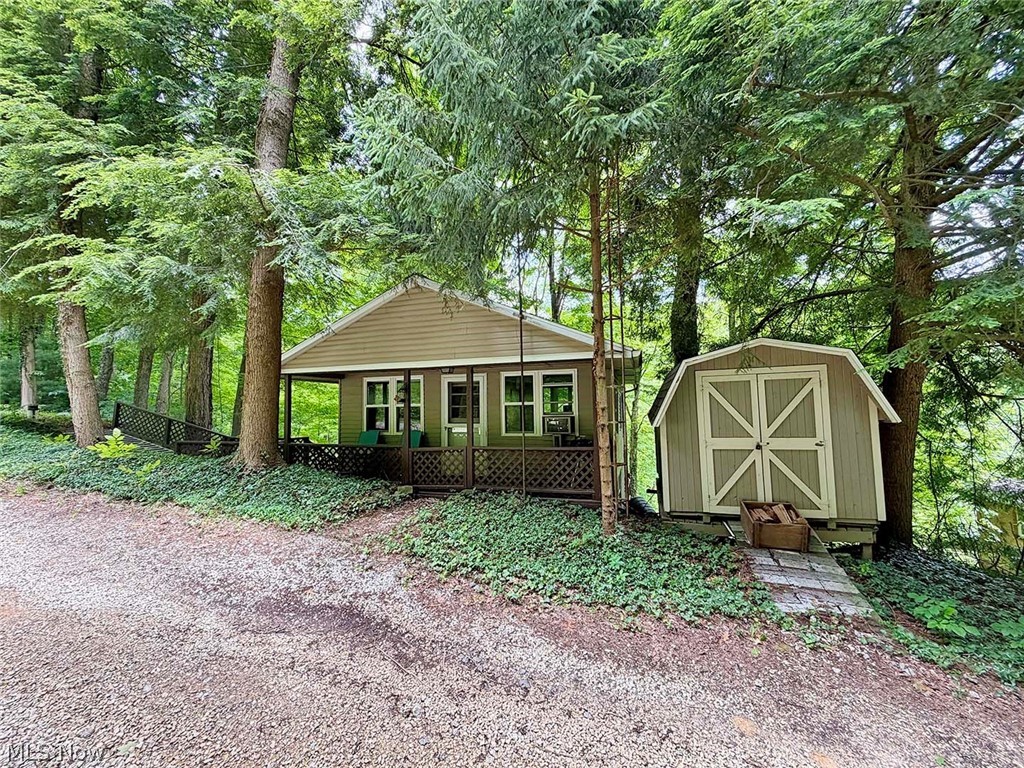 Move-In-Ready Leesville Lake Cottage. Quiet location with dock slips available. Potential for year-round living, short-term rental or weekend getaway. Affordable Lake living. Large, shaded exterior deck. 1 bedroom, 1 full bath, full kitchen and living room with wood stove. Owned private land, (2) 50’x100’ lots. Private water well and septic system. New roof in 2016. Serene walking path from the cabin to your boat dock, approximately 400 yds. Gravel parking area. Mobility ramp access.