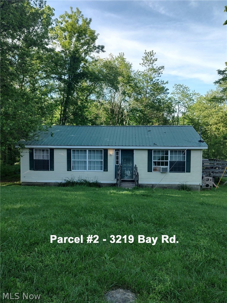 10+ Acres, 2 Homes, Private Setting 
Woods, Spring, Pond, Sells Your Way!

Private Scenic Setting
Carroll County, Lee Twp. 
Carrollton EVSD
Offered In Parcels And Entirety
Sell Whichever Way Brings The Most
Live Auction With Online Bidding Available 
Absolute auction, all sells to the highest bidder. 
ONLINE BIDDING BEGINS FRIDAY, JUNE 19, 2026, AT 9:00 AM, AND AUCTION LIVE ON-SITE BIDDING WILL BEGIN
SATURDAY, June 20, 2026, 10:30 AM
Carroll County parcels #17-0000527.000 & #17-0000527.003.
Approx. 10.16 total acres. Adjoining country tracts with a private, scenic setting featuring woods, spring-fed water, and creek. 
Parcel #1 - 3211 Bay Rd. SE, 5.05 Acres. 

Parcel #2 – 3219 Bay Rd., 5.11 Acres.
Three-bedroom, two-bath modular home on permanent foundation. Approx. 1,107 sq. ft. Ranch home with garden-style tub and wooded acreage. Metal roof installed approx. 10 years ago. Property features remaining farmhouse structure and a natural stone spring feeding a creek. Private well and septic.
Currently rented. Long-term tenant of 11 years.
Total taxes in 2025 were $2,408.52.