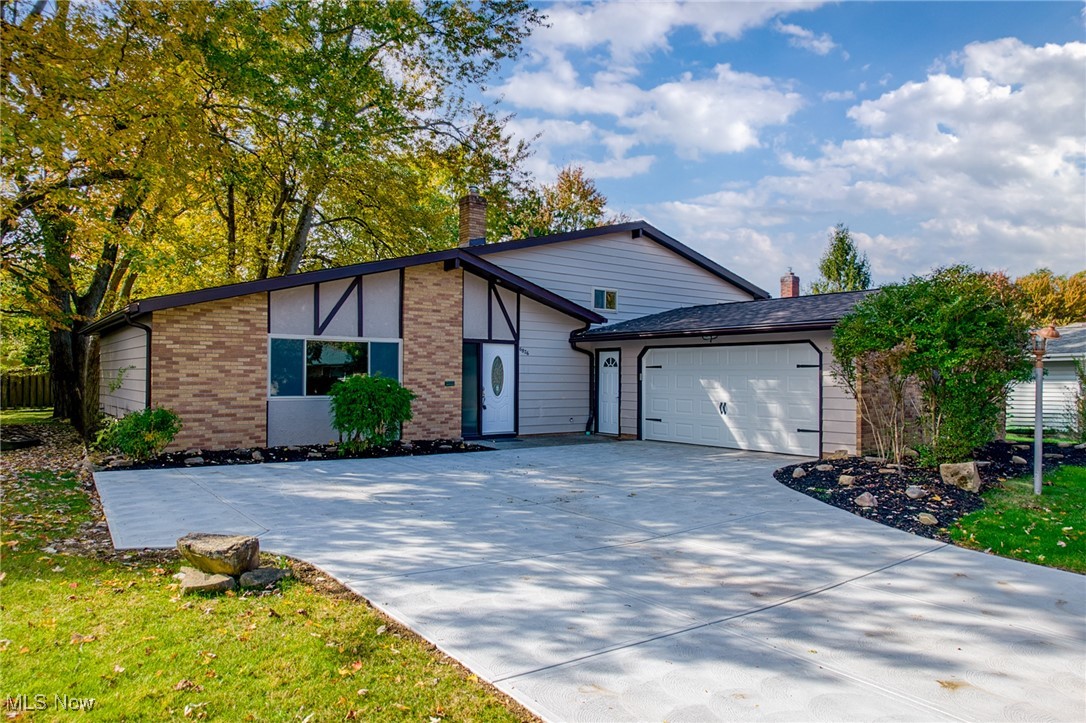 Your dream home awaits in this beautifully renovated split-level residence, where modern elegance meets comfort. This stunning 3-bedroom, 2-full bath home features a convenient 2-car attached garage and has been meticulously updated throughout. Step into a gorgeous kitchen  with white cabinets, beautiful countertops, new carpet, and modern fixtures, all complemented by luxury vinyl flooring that adds both style and ease of maintenance. Thoughtful renovations include a new driveway, a patio perfect for outdoor entertaining, and many newer windows that fill the space with natural light. The spacious backyard is ideal for gatherings, making it a great spot for relaxation. Located in a great neighborhood, this home is conveniently located near schools, parks, shopping, and dining options. Don’t miss the chance to own this exceptional property—schedule your viewing today!