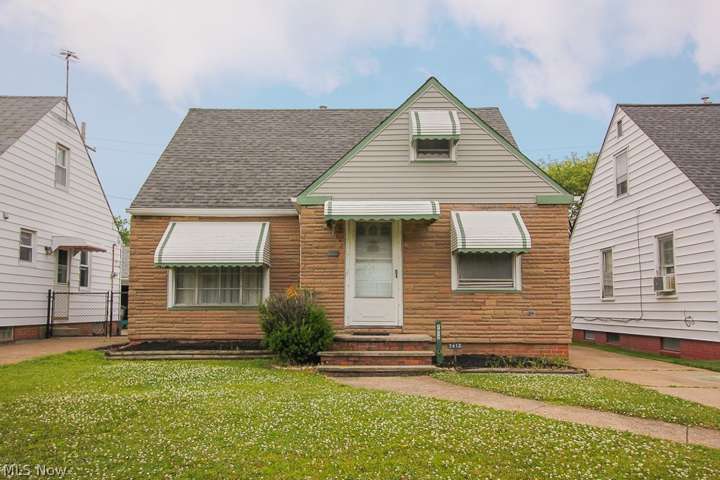 Location, Location, Location! 
With some cosmetic updating, make this one your own! 
Nice eat in kitchen and wood floors throughout the first floor.
Full bath on the first floor and a convenient half bath in the upstairs dormer.