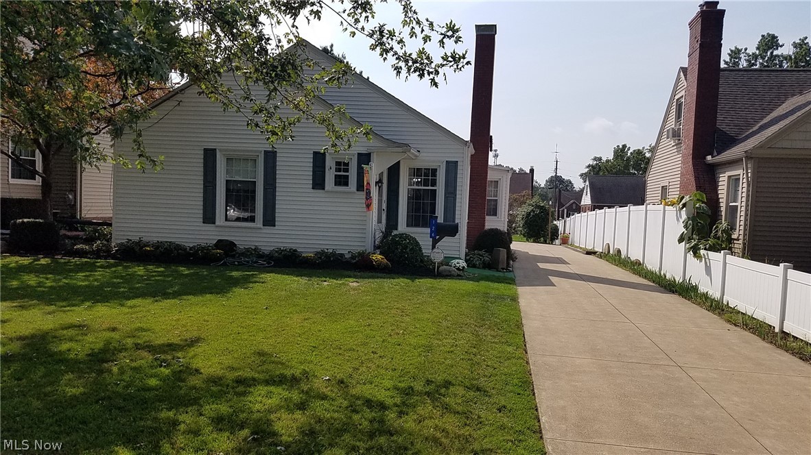 Move In Conditions with great curb appeal. Breezeway has stamped concrete floor. Wood burning fireplace is ready for those chilly winter nights that you know are coming. Open concept living room and dining room. Kitchen has a Dutch door leading out to the breezeway. 
Finished basement with finished 1/2 bath also has a free standing shower on the other side of the basement.  Reverse osmosis water filter is included as is the central vacuum with all the attachments. Glass block windows in the basement.
Large planting bed in the back has been prepped and put away for the winter.
This home has been impeccably maintained.  Refrigerator in the basement is included