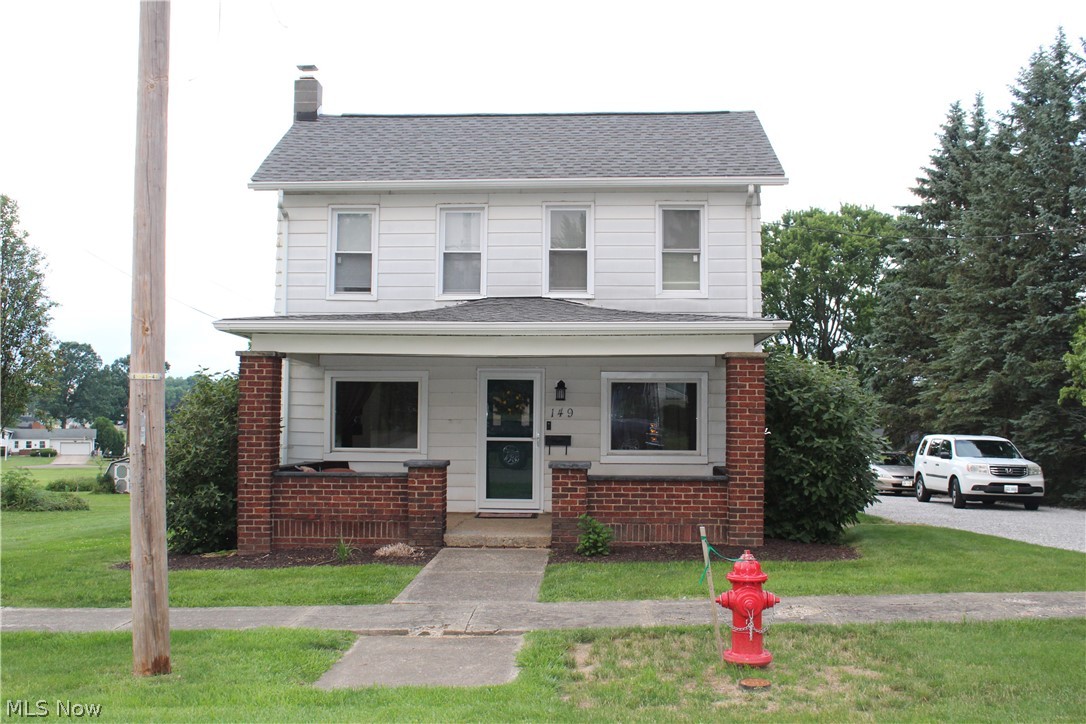 Lovely colonial with HUGE .44 acre lot in E. Canton.  2 Car garage, storage shed, long drive with room for numerous vehicles.  This home features a whopping 1,956 sq, ft, not counting the walk-up attic for storage and clean, bright basement!  The livingroom encompasses the entire front of the house featuring a 9x20 front porch perfect for sipping tea on a warm summer evening!  Huge country kitchen with the original hardwood floor and a formal dining room just a few steps down with it's own exterior entrance.  And don't forget the butler's pantry in between that also has the original hardwood floor AND a vaulted ceiling!  The side entrance leads to a large mudroom/laundry room combo filled with cupboards, shelving and even the antique kitchen sink!  
There is also a full bath on the first floor.  Upstairs has 3 ample bedrooms and the master has a large adjoining walk-in closet that could be used as a nursery, office or play room along with a 2nd closet. The walk-up attic affords extra storage space.  Appliances staying include washer, dryer, microwave, dishwasher and water softener.  The 20x24 two-car garage has vinyl siding with newer concrete aprons.  Extra storage available in the 12x12 storage building.  Roof and chimney were replaced six years ago.  Playset is negotiable.