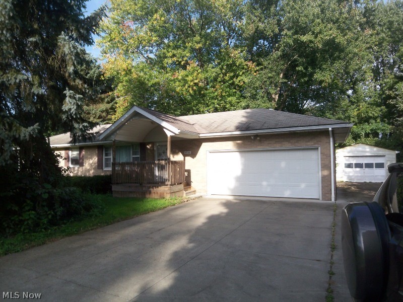 First Floor living in Coventry Ohio; this brick ranch is great for a new family or retiree. Pull into your large two car attached garage, dry off in your mudroom and walk into the large eat in kitchen with mid century charm, to left of the kitchen is the bright living room with hardwood floors. Down the hall from the kitchen you'll find a large full bathroom and  three bedrooms, one with attached half bath. There is a bonus three seasons room behind the garage with lots of natural light, perfect for a gardening guru. Full basement partial finished with washer and dryer. Tenants pay all Utilities. Proof of Renters insurance is required. Schedule your viewing soon. Sign an 18 month lease and receive a reduction in monthly rent.