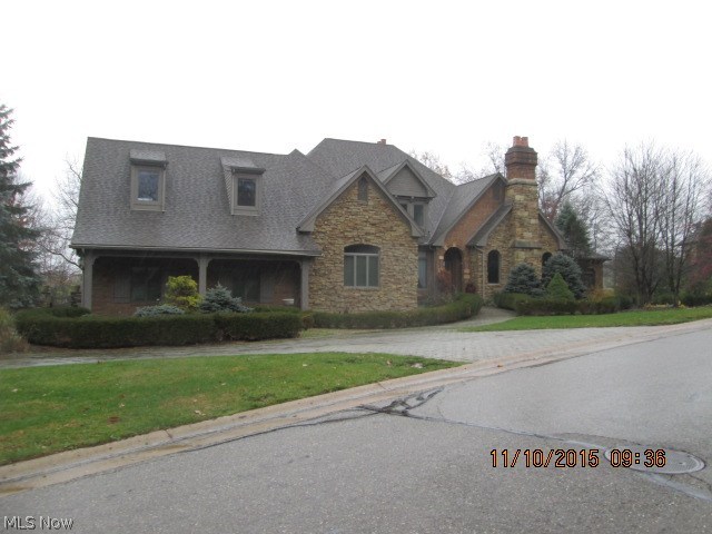 Too many extras to mention.  5 fireplaces, stone patios, 3 full baths, half bath, bar in finished basement & heated floors.  Overlooks Glenmoor Golf Course.