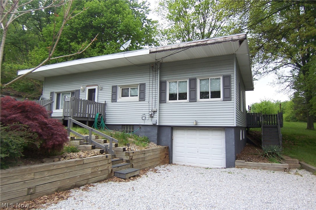 Great potential! Deep private backyard, almost acre! 2 bed with 3rd bed in lower level! Living room with woodburning fireplace and large family room that opens to large rear deck! Selling as is. No FHA, VA. Seller has never lived in property, was rental. Garage under family room, 2nd full bath in basement. Basement was waterproofed prior to seller owning, no paperwork.  Hardwood floors under some flooring.