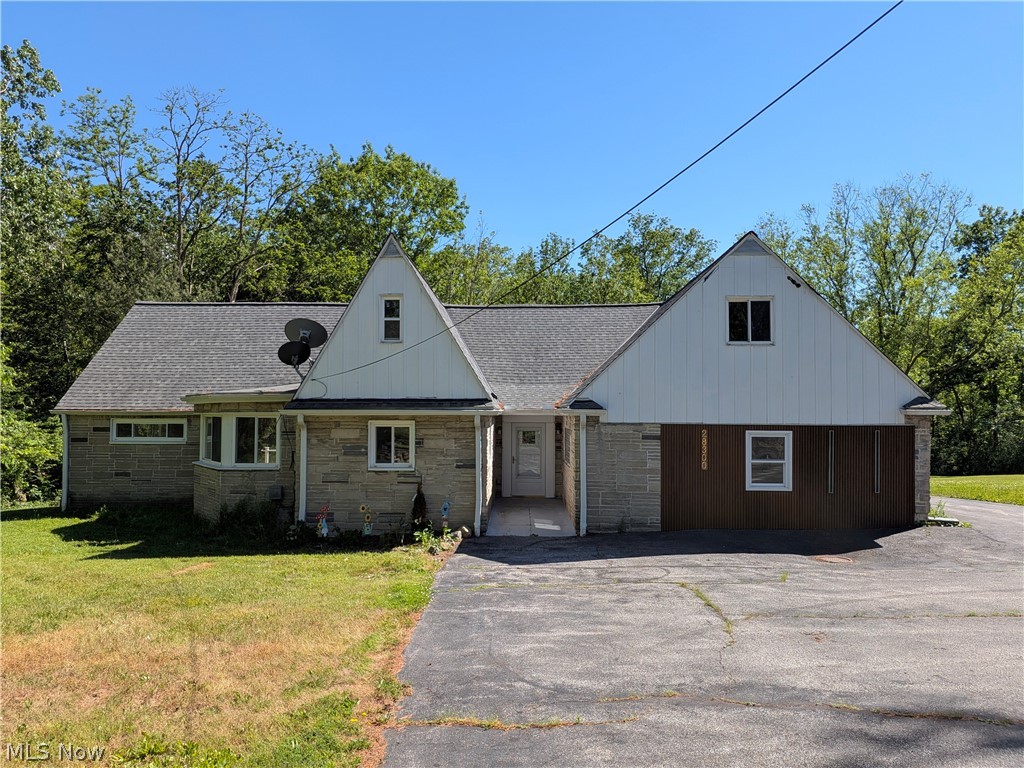 This fully renovated 2637 sqft home offers five spacious bedrooms and three full bathrooms, including an additional area with its own kitchen, living, and full bath with a tiled shower. Make it an in-law suite, or an entertainment area - options are limitless. The main kitchen has been completely updated with stainless steel appliances, new cabinetry, modern backsplash, and updated flooring. An open dining area flows seamlessly into a large great room with sliding doors that lead to a brand-new composite deck, perfect for relaxing or entertaining. The interior has been upgraded throughout with new hardwood flooring in the main living areas, luxury vinyl tile in the downstairs bedrooms, fresh carpet upstairs, and a newly built custom walk-in closet. All bathrooms have been fully renovated, with additional privacy features added to the upstairs layout. The home also features fresh interior paint, updated water and light fixtures, and a completely refreshed finish in the in-law suite. Exterior improvements include new siding and lighting on the front wall, a newly repainted detached two-car garage, a brand-new AC unit, and an upgraded furnace coil for efficient cooling. This home blends modern updates with functional, flexible living and is move-in ready.