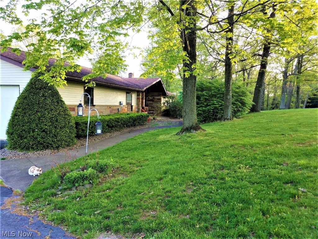 4 bedroom ranch style home on 13+ acres with 2 car attached garage PLUS 30x48 detached garage with electric, in ground swimming pool & hot tub, 3 levels of decks, and a totally updated kitchen! Kitchen 2018 with granite counter tops, ceramic tile floor, & glass tile back splash. Laundry is in Master bathroom. Spiral staircase to lower level which features a second kitchen, the fourth bedroom and large Rec Room with wood burning fireplace and walk out to pool. Pool table stays.