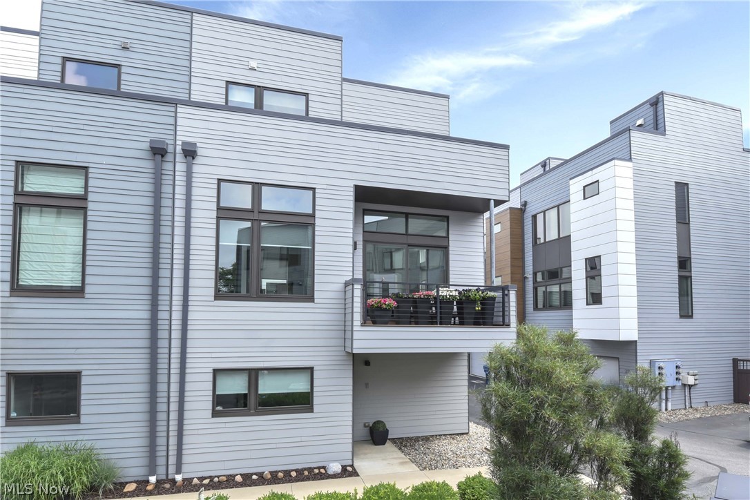 Prepare to be moved by this stunning, multi-level modern townhouse located at 18875 Riversouth #11, Fairview Park, OH 44126. This meticulously detailed residence features 1 bedroom, 1 full bathroom, and 1 half bathroom spread across over 1,691 square feet of finished above-ground living area. Boasting an attached two-car garage, central air conditioning, and forced air heating, this home seamlessly blends convenience with contemporary style. Step inside through the welcoming entrance and experience an open-concept adorned with pristine flooring. The expansive living room, complete with a cozy fireplace, serves as an ideal space for entertaining guests or unwinding after a long day. The recently updated gourmet kitchen features beautiful cabinetry, sleek surfaces, and a designated dining area. A convenient half bathroom rounds out the main floor before you head upstairs. The entire second level functions as a private, luxurious primary suite. The generous bedroom offers ample natural light and shares the upper level with a dedicated laundry room. Pamper yourself in the spa-like bathroom, featuring premium flooring and a massive walk-in closet space. Step outside onto your own private balcony to enjoy a peaceful evening overlooking the surrounding community. Outdoor enthusiasts will love the close proximity to the scenic Rocky River Reservation's endless all-purpose trails. For premier indoor recreation, swimming, and fitness, the state-of-the-art Gemini Center is only minutes away, while the local Westgate area offers incredible shopping. Food lovers can indulge in local favorites right down the street. Don't miss your chance to own this rare architectural gem; call today to schedule your private tour and make this dream home yours before it slips away!