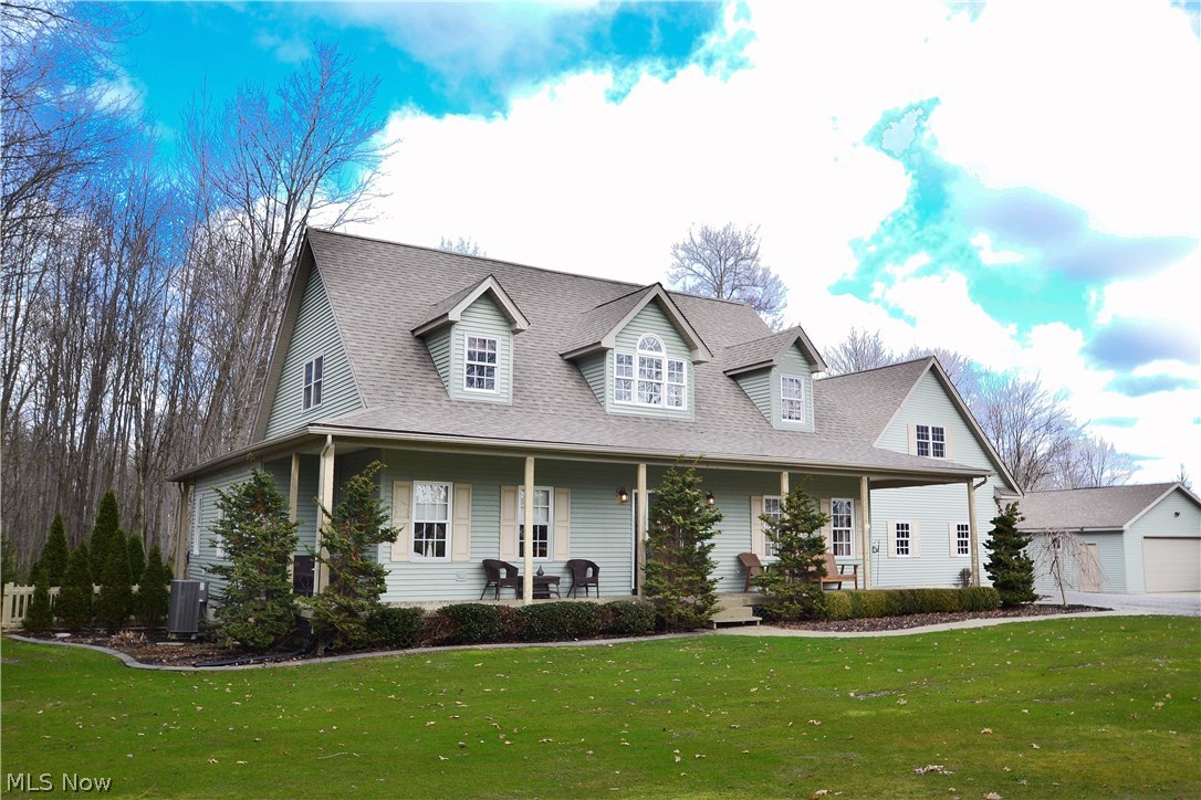Sought after country retreat on 4 acres of land is finally here! As you pull up to this beautiful cape cod, envision yourself relaxing on the front porch, entertaining guests on the deck/pool area, or maybe working on old cars, cleaning your boat, or woodworking/crafting in the extra workshop garage! This home has so much to offer. Even a chicken coop, for an authentic farm experience! Your guests will admire the open floor plan with beautiful woodwork and stone fireplace with wooden mantle. Your large, first floor master suite is complemented by an elegant full bathroom, and has sliding french doors with a beautiful view of your backyard. Plenty more room for entertainment awaits in the finished walk-out basement, complete with a woodburner and plenty of extra storage. You can also get your game on in the game room above the garage! Lots of functional space makes this home the perfect place to entertain and enjoy your time. Cleaning is simplified with a central vacuum! All major systems are very well cared for. Owner has detailed maintenance instructions and phone numbers for trusted professionals. Furnace is only 7 years old and well maintained. Location is prime- ten minutes from Firestone Farms, downtown Columbiana, and the Lake Club. You do not want to miss this opportunity! Schedule your showing today!