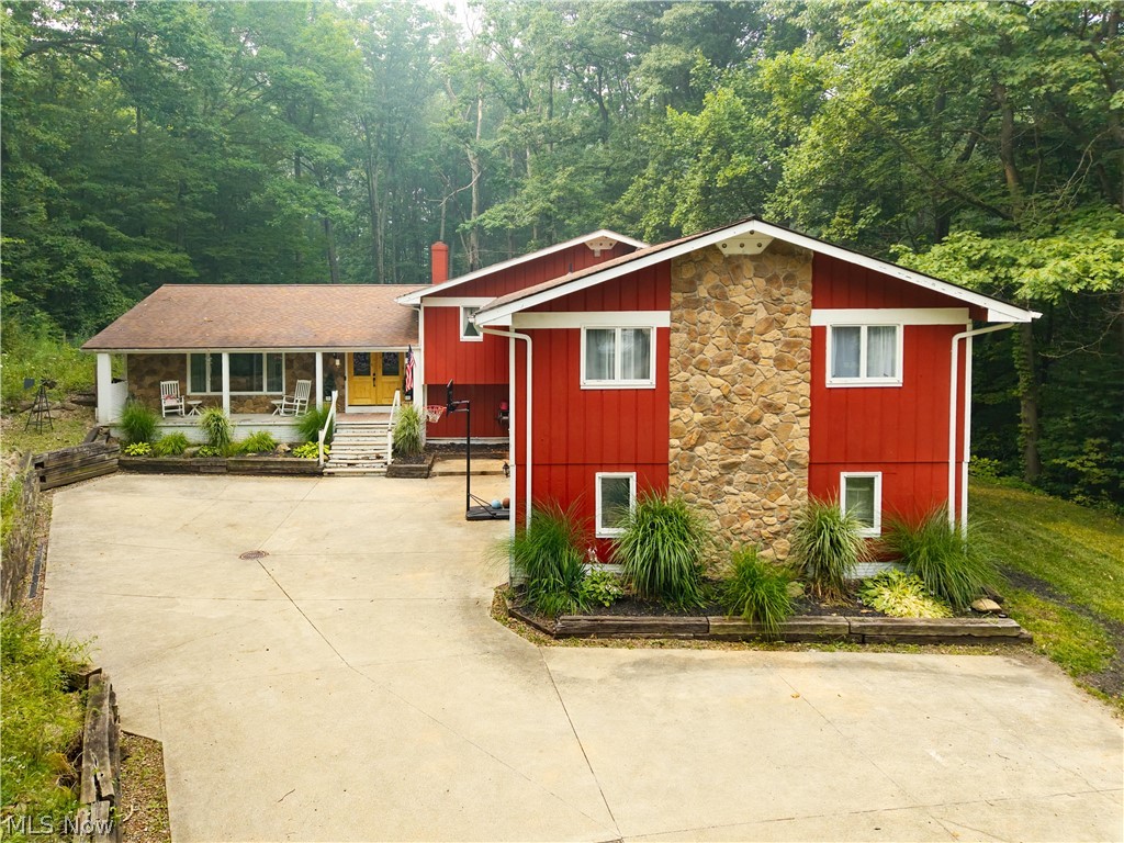 Welcome to this beautiful spacious home in Hinckley, located within the Highland school district. This 7 bedroom,3.5 Bath, 4 level split offers over 4,000 square feet of living space situated on a private, park-like 2.8-acre lot near the Hinckley Reservation. Newer carpet throughout much of the home and many rooms recently painted. A large foyer welcomes you into the lovely home, an open living room and dining room, and a spacious kitchen with all appliances staying! Slider from the dining area out to the deck and park-like backyard. A huge family room features wooded views, slider access to the yard, and a natural gas fireplace, along with an additional bonus room with a wet bar/sink area (was a billiards room) and 1/2 bath. A hall leads to the utility room and garage access. All bedrooms are located upstairs, including a main bathroom and a master suite with a walk-in closet, a private deck, and a laundry room, completing the upper level. A secluded yard featuring a deck, patio space, an above-ground pool, a gazebo, and multiple storage sheds or livestock shelters. An oversized 2.5-car garage includes a full bathroom and a utility sink. The lower level basement space is perfect for storage or a workshop as it is currently being used. New roof (2014), a water softener and a drinking water filter system (2014). With its abundant space and serene location, this property offers endless possibilities! Schedule a private tour today!