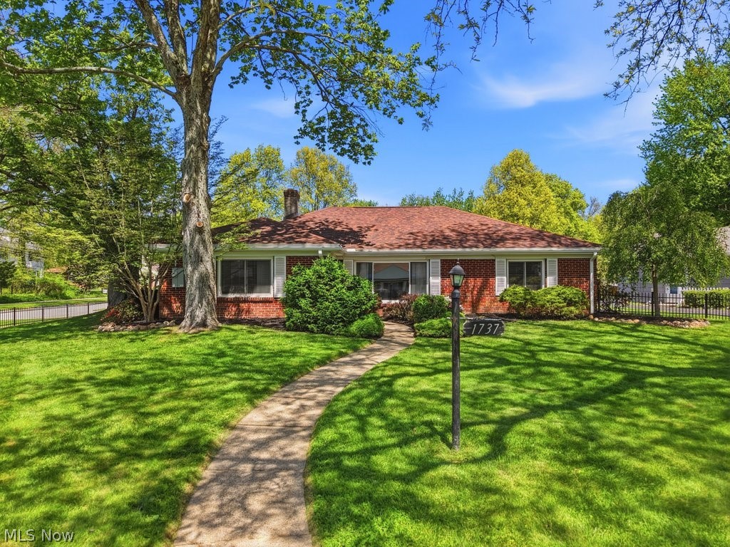 This Stunning Brick Ranch boasts 2,274 sqft , 4 bedrooms, 3 bathrooms and multiple living spaces to spread out in. The spacious layout features an updated kitchen with granite counters, new fixtures and hard surface flooring. All appliances convey! Kitchen is open to a large living room complete with picture window and stone fireplace. The primary bedroom has access to its own private patio as well as an updated primary bathroom with multiple vanities and double closets! Three additional bedrooms share a large guest bathroom. At the back of the home you'll find a cozy family room/ den and updated half bathroom. A large laundry room w/built in cabinets and utility sink completes this impressive interior! Washer and Dryer convey! Exterior boasts mature landscaping, fenced in yard and large 2 car garage with ample storage! Do not miss your chance to view this incredible home located in the heart of Cuyahoga Falls with convenient access to the Gorge trail directly across the street!