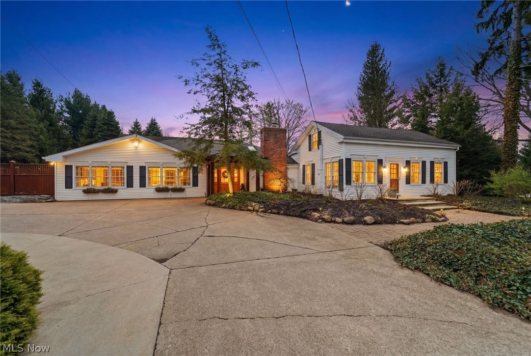 An extraordinary, one-of-a-kind estate where timeless character meets elevated luxury living. The beautifully remodeled century home, thoughtfully expanded, offers 5 bdrms and 4 full baths, blending historic charm with modern sophistication. The front entry opens to a beamed dining room with a floor-to-ceiling stone fireplace. The inviting great room features a stunning stone hearth w/wood-burning fireplace, while the sunlit morning room—with sliders to the outdoor entertaining spaces—creates seamless indoor-outdoor living. At the heart of the home is a true gourmet kitchen designed for everyday living and entertaining, complete with a large breakfast bar, Quartz countertops, and premium appliances including a Sub-Zero refrigerator/freezer, wine cooler, Bosch dishwasher, double ovens w/warming drawer, and a 6-burner Wolf cooktop. The main level continues with an expansive family room with custom built-ins, an office flowing into a game room, additional bdrms, and a spectacular screened-in porch with kitchenette. The second-level primary suite has its own private staircase and features an ensuite bath, custom closets, and a dedicated dressing area. Throughout, exquisite craftsmanship shines with rich woodwork, solid wood doors, and maple and hickory flooring. NEW ROOF 6/2026. The second structure—zoned for office use—offers its own driveway, kitchen, full bath, and flexible living spaces, ideal for a home business or guest quarters, also a NEW ROOF 6/2026. The impressive 3,400+ sq ft “Party Barn” is an entertainer’s dream with a large open area, full kitchen, dining space, full bath, and loft with two additional rooms. Additional outbuildings include a charming former sugar house and multiple storage structures. Outdoor amenities rival a private resort, featuring a pool house w/full bath, steam shower, and changing rooms adjacent to the in-ground pool w/surround patio area. A property standby generator and lush landscaping complete this exceptional private oasis.