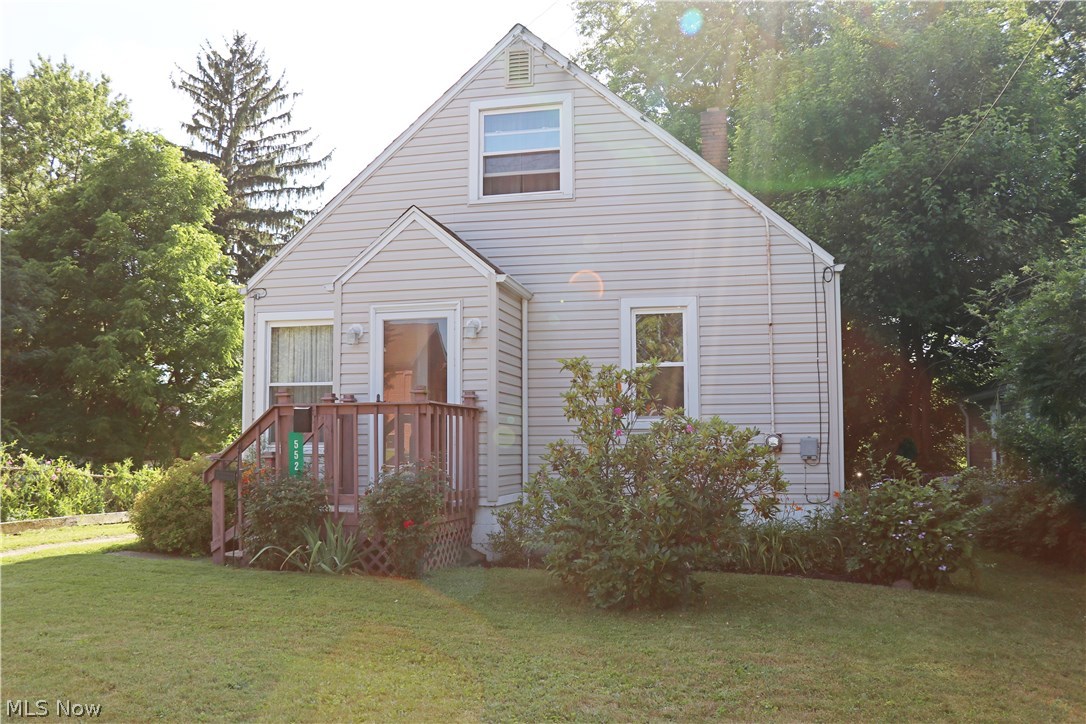 Super charming Ellet Cape Cod.  This home has been loved and well cared for.  Recent roof, siding, gutters and windows.  Lovely private back yard with beautiful flowers and fresh mulch.  Front entry has a nice corridor for shoes and coats.  Newer carpet through living room, hall and bedrooms.  Nice open floor plan with living room opening into the dining area.  Nice kitchen with newer laminate floors and ceiling fan, gas range and refrigerator stay.  Two nice sized bedrooms on the main level and the larger master bedroom on the second.  Larger bedroom has a very large closet and built-ins.  Bathroom has newer toilet, vanity, surround, flooring and vent.  Linen and coat closets in the hallway.  Hardwood floors under carpets.  Large open basement offers tons of storage and the potential to finish for more living space.  Glass block windows, hot water tank new 2015, undated electrical and fruit cellar.  Please forgive the boxes on second floor.