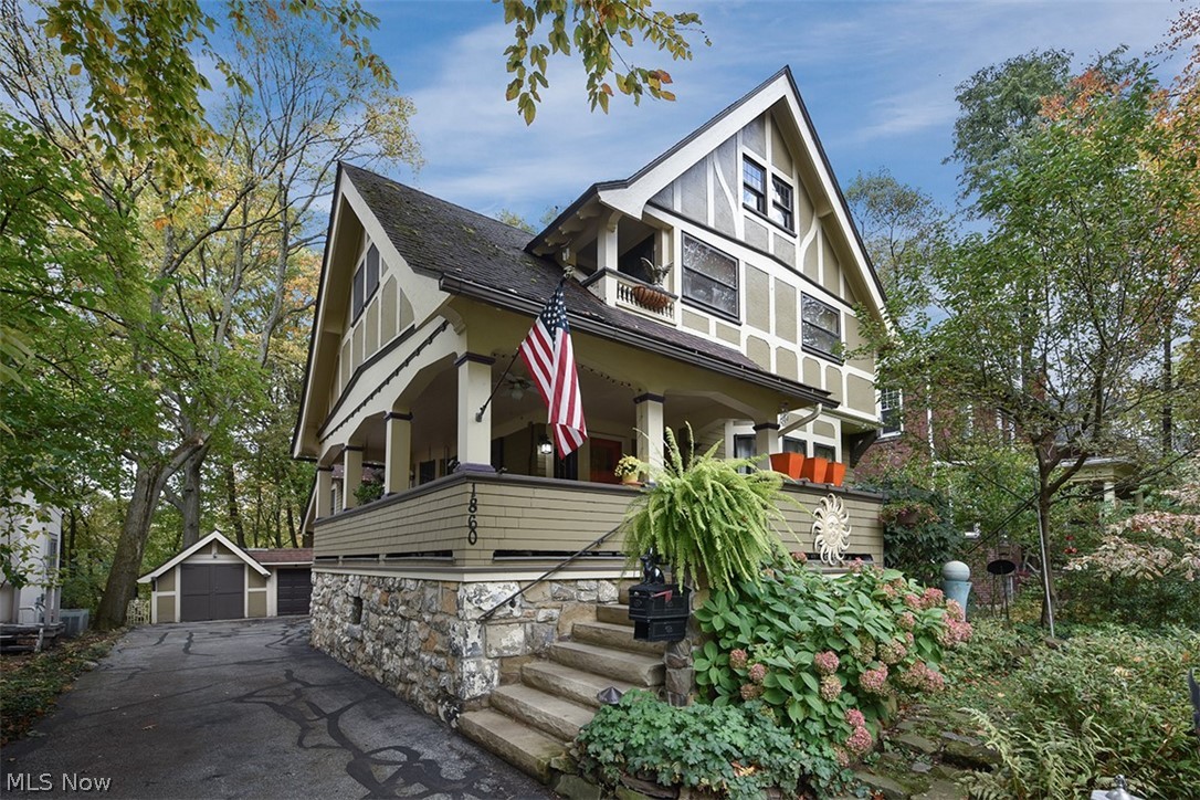 Charming and warm Coventry Village gem available for the first time in almost 30 years!!   Beautiful wooded lot with views of Coventry village.  Easy walk to the  village, parks, Cumberland Pool, playgrounds, shopping and restaurants.  Surrounded by incredible homes in a classic Cleveland Heights neighborhood. This home offers excellent entertaining potential with tiered wood deck in the rear, and covered front porch complete with a bench swing!   Open concept eat-in kitchen, gracious entry, formal dining room and a spacious living room complete this wonderful floorplan.  Garage offers extra space for work-shop or hobby studio.  The perennial garden in the front is a neighborhood favorite!  Schedule your private showing today!!!