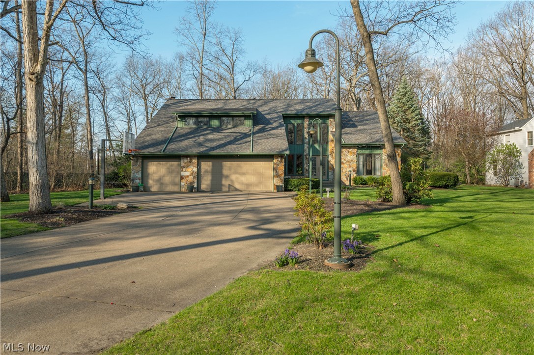Beautifully upgraded and move-in ready, this spacious home features a grand two-story foyer with an alabaster chandelier. The gourmet kitchen offers granite countertops, stainless steel appliances, and a center island, opening to a cozy family room with a gas fireplace and adjacent flex room. All four bedrooms are located upstairs, including two with private sitting areas. The oversized primary suite includes space for an office or exercise area, dual walk-in closets, and a private bath with a glass-enclosed shower and dual vanities. The finished basement is ideal for entertaining with a fireplace, full bar, and billiards room. Enjoy outdoor living on the expansive 1,800 sq ft deck overlooking a 1.5 acre wooded, lighted lot, featuring an automatic awning, hot tub, and heated gazebo. Additional features include a 3-car garage, sprinkler system, and newer roof (under 5 years).