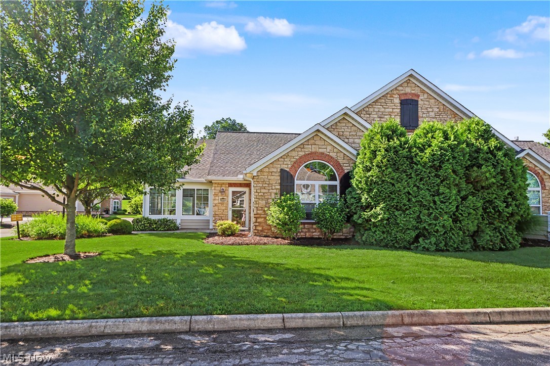 Enjoy the ease of condominium living in this beautifully maintained Bridgewater home! Natural light pours through the stunning four-season sunroom, creating a bright and inviting space to relax year-round. The open-concept floor plan features soaring cathedral ceilings, a spacious living room with a cozy gas fireplace, and a dining area that flows seamlessly into the kitchen. Granite countertops, abundant cabinetry, and a breakfast bar make the kitchen both functional and welcoming. The primary suite offers a remodeled bath and a large walk-in closet, while the second bedroom also features its own bath, turning this into a condo with two primary suites and two walk in closets. Recent updates include a brand new roof (June 2026), carpeting (2026), kitchen and dining room flooring, updated bathrooms, newer appliances, wainscoting, faucets, and a tankless water heater. Additional highlights include a 2.5-car attached garage and extra storage closet off the laundry room.