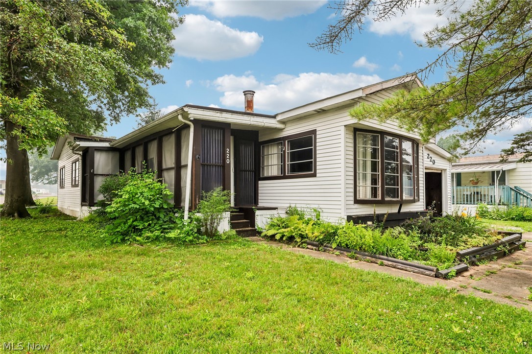 Welcome to 18592 Edwards Rd., Lot 220 in Doylestown! This well-maintained manufactured home offers more living space than many homes in the community thanks to its spacious enclosed four-season room, providing the perfect place to relax year-round. The home features two spacious bedrooms, a full bathroom with a double vanity, an open-concept kitchen with an island, and a versatile front room ideal for a home office, sitting area, or hobby space. Outside, you'll appreciate the extra-deep attached carport with tandem parking for two vehicles, along with an attached storage shed featuring its own separate entrance. Situated on a desirable corner lot near the back of the park, the property offers a peaceful, private setting with mature trees out front. The community is conveniently located near the highway for easy commuting and features a private lake and park-like common areas for residents to enjoy. With its generous living space, abundant storage, private setting, and attractive price, this home offers an excellent opportunity for buyers seeking comfortable, affordable living. Contact our office today to schedule your private showing or submit your offer!