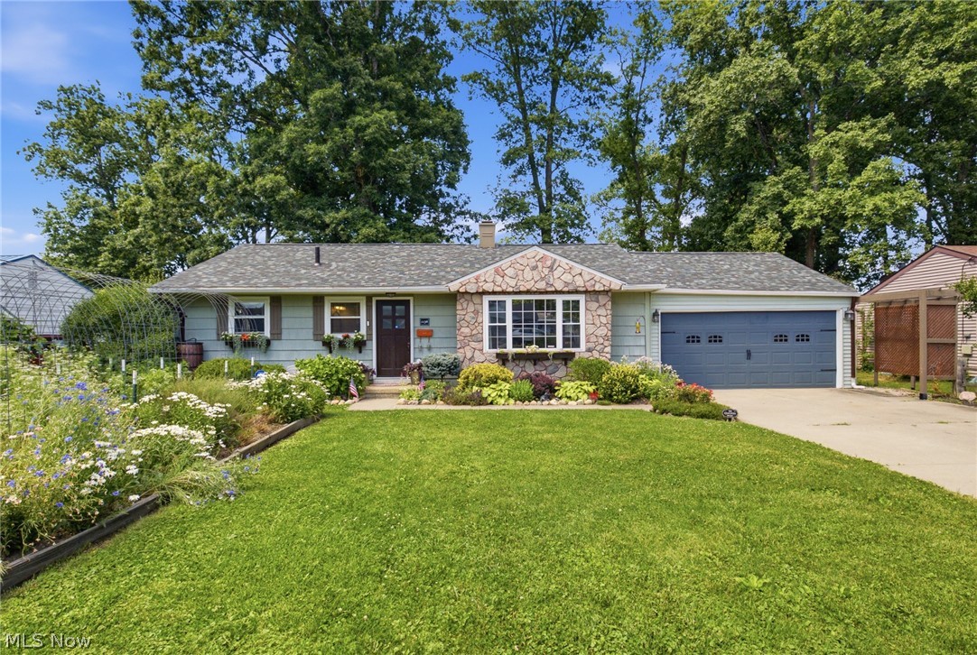 Conveniently located near Brookside Park, this home offers easy access to many sought after local favorites. Inside, you’ll find a built in bookshelf and reading seat beside the wood-burning fireplace, an ideal cozy spot. The home showcases unique custom finishes throughout and is beautifully designed with butcher block countertops and a brick framed double oven that serves as a centerpiece to the kitchen. The front yard features garden boxes with fresh vegetables, beautiful flower beds, and a rainwater barrel for convenient plant watering. The fenced in backyard offers privacy and plenty of space for activities, hosting, or simply a relaxing space for your own. Purchase with the reassurance of a new roof & roof decking installed in April 2026 with a 50 year transferable warranty. This one of a kind property offers the feel of country tranquility with the conveniences of city life. If “cookie-cutter” homes are not for you and you’re looking for one with character, THIS is the house!