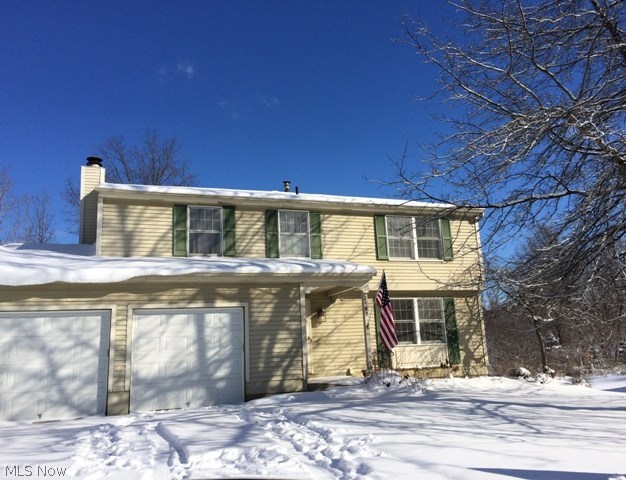 Wonderful family friendly neighborhood.  Home is located on a park like cul-de-sac and backs up to Silver Springs Park.  This lovely 4 bedroom 2 1/2 bath colonial is freshly painted throughout.  There are hardwood floors in the living room, dining room, and family room.  The foyer and kitchen have a slate floor. Going up the stairs to the bedrooms there are beautiful hardwood steps and the upstairs has brand new carpeting.  There are many updates including a solid surface counter in kitchen and all the appliances are stainless steel and remain with the home. Bathrooms have also been updated.
The family room boasts a wood burning fireplace and leads out to a very large deck and private back yard.  
 Lovely home in a great area of Stow.  Don't miss seeing it.