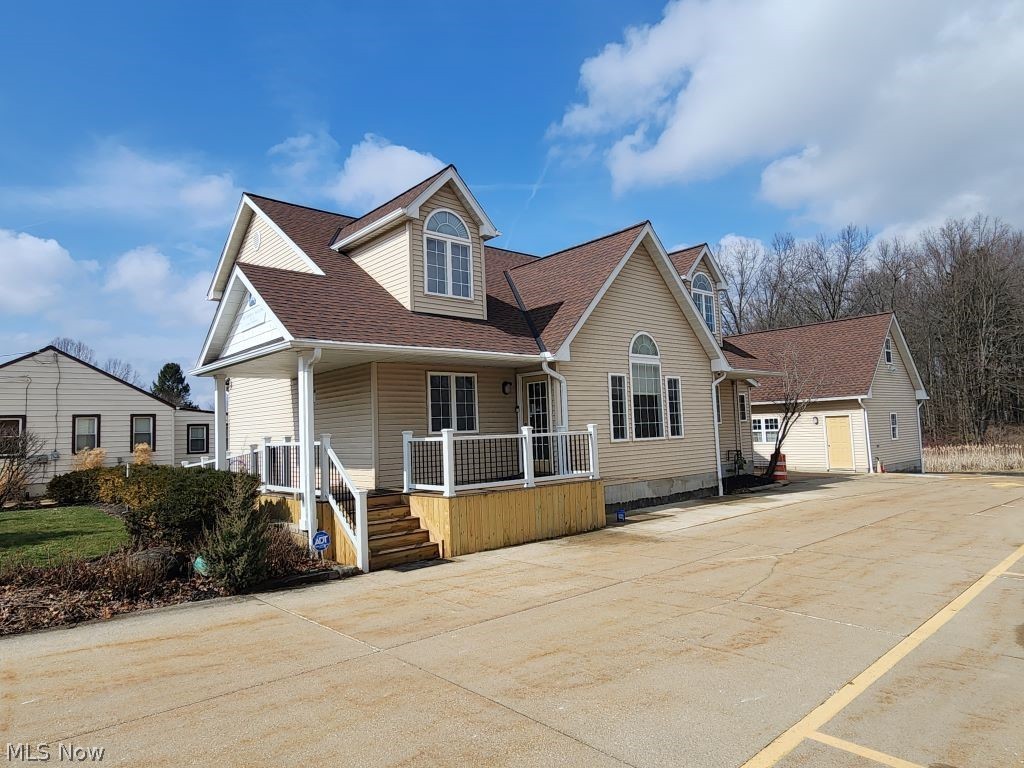 Incredible opportunity to house your expanding business or earn extra income from the 5 units in this building. With a walkout basement  (half unfinished) and 2 acres to expand on or diversify the possibilities are unlimited. The convenient 2 car garage with office space on the second floor is an added bonus.