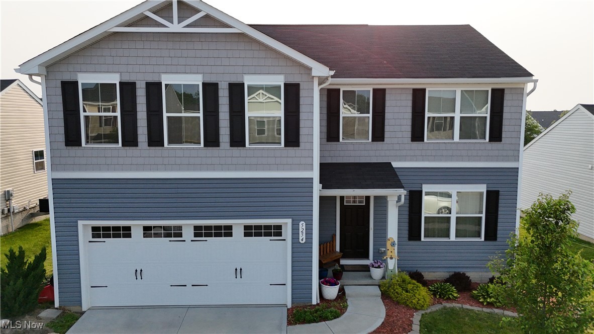 Welcome to 5254 Decker St, a stunning 5-bedroom, 2.5-bath home located in the highly sought-after New Haven neighborhood of Barberton! Close access to I-76 makes commuting a breeze. This modern and newly built home offers well over 2,000 sqft of beautifully designed living space. Step inside to find a bright, open and inviting floor plan featuring a spacious entryway that flows seamlessly into the family room area w/ a half bath.  The gorgeous eat-in kitchen boasts ample cabinet space, a large center island, and modern finishes—ideal for everyday living and entertaining. Upstairs, the expansive master suite is complete with his and hers walk-in closets and an en-suite bathroom w/ dimming lights, a double vanity, and standing shower. Four additional bedrooms provide plenty of space for family, guests, or a home office. Finishing the second floor is a convenient laundry room and full bathroom w/ double sinks. Walk out the sliding glass doors to find your private backyard with a lovely patio and pergola—perfect for relaxing or hosting summer gatherings. With no rear neighbors, you’ll enjoy added privacy, and you’re located conveniently close to the community park. The attached 2-car garage and full basement adds plenty of additional space to utilize. Don’t miss your chance to own this move-in-ready home in one of Barberton’s most desirable neighborhoods. Close to shopping, restaurants, parks, and more! Schedule your private tour TODAY!
