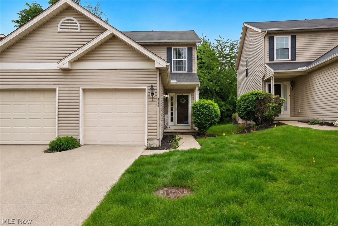 Welcome home to 606 Birch Hill Drive in the heart of Medina, Ohio! This charming 2-bedroom townhouse offers the perfect blend of comfort, style, and low-maintenance living. Nestled in a peaceful setting backing to trees, this home provides both privacy and convenience. Step inside to discover a bright and inviting floor plan featuring a spacious living room with a cozy fireplace and classic mantel — the perfect spot to relax or entertain. Sliding doors lead to a private patio complete with a partial privacy fence, creating an ideal outdoor retreat. The kitchen is equipped with stainless steel appliances and offers plenty of space for cooking and gathering. A convenient half bath is located on the main level. Upstairs, the vaulted primary suite features a skylight, attached full bath, and an airy, open feel. The second vaulted bedroom is generously sized and also has access to the full bath on the upper level. The basement provides abundant storage space and includes an egress window, offering exciting potential to finish the area into additional living space, recreation room, or guest suite. It is already plumbed for a full bath, making future expansion even easier. Enjoy stress-free living with HOA services that include lawn maintenance and snow removal. For added buyer confidence and peace of mind, a home warranty is also included. Don’t miss this opportunity to own a beautifully maintained townhouse in a desirable Medina location!