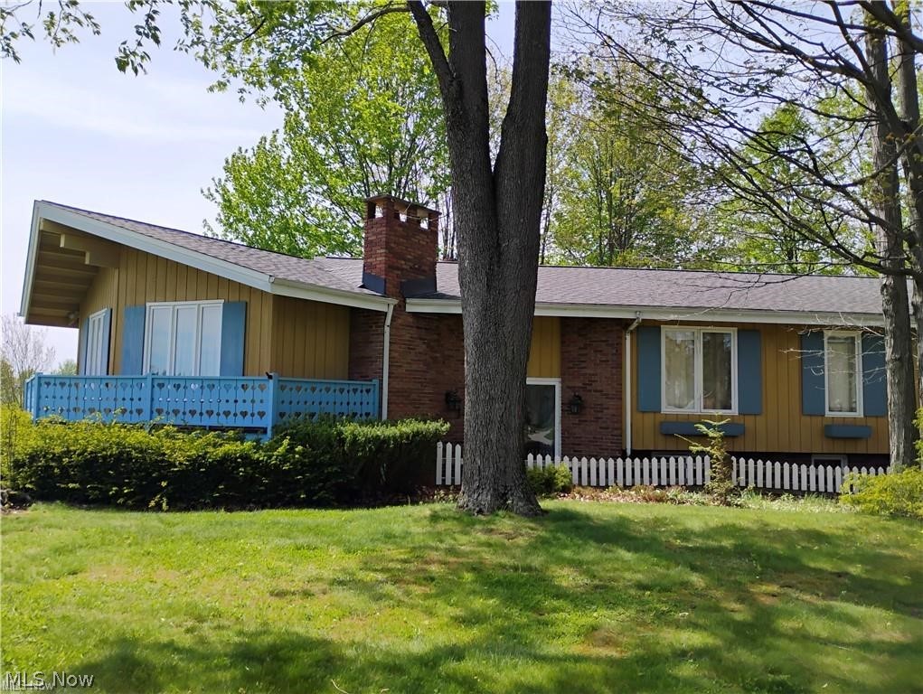 Unique multi-level home that boasts 5 bedrooms plus 4 car garage.  Separate in law suite above second garage with living room, kitchen, laundry and bedrooms. Home was by Schneider Construction. One of the features is the old-world charm as soon as you walk into the two-story foyer. Nice hardwood flooring in much of the home. There are two beautiful red brick fireplaces, one in the living room and the other in the family room which has newer flooring. This home has so much to offer. New roof 2020, A/C 2025, In law furnace 2020, Dishwasher 2023, 2 story windows in kitchen/family room 2021. Old Mill Village offers tennis courts, pool and club house. Located on cul de sac.
