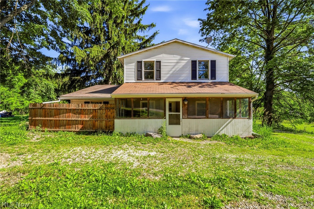 Welcome home to this spacious and versatile property offering over 2,100 square feet of living space, featuring 4 bedrooms plus a dedicated library/den that could easily serve as a 5th bedroom, home office, playroom, or hobby space. With room to grow and a flexible layout, this home provides options for a variety of lifestyles.

Relax and enjoy your morning coffee or evening sunsets from the inviting screened-in front porch, a perfect extension of the home's living space.

The standout feature of this property is the incredible garage setup. Detached from the home, you'll find an attached 2.5-car garage and a massive commercial-style garage with soaring ceilings, oversized doors, and an abundance of space for vehicles, equipment, storage, hobbies, or a home-based business. The garage complex also includes a heated garage area, making it functional year-round. Whether you're a contractor, mechanic, collector, entrepreneur, or simply someone who appreciates exceptional workspace, opportunities like this are incredibly rare.

Inside, you'll find a fully renovated and beautifully updated upstairs bathroom, new carpet, and numerous updates throughout the home. Major improvements include many vinyl replacement windows, newer electrical service and panel, newer furnace, newer central air, newer water tank, newer well, and a newer invisible pet fence.

Offering space, flexibility, and a garage setup that is nearly impossible to find in today's market, this unique property delivers tremendous value and endless possibilities. Schedule your private showing today!  Property is agent owned