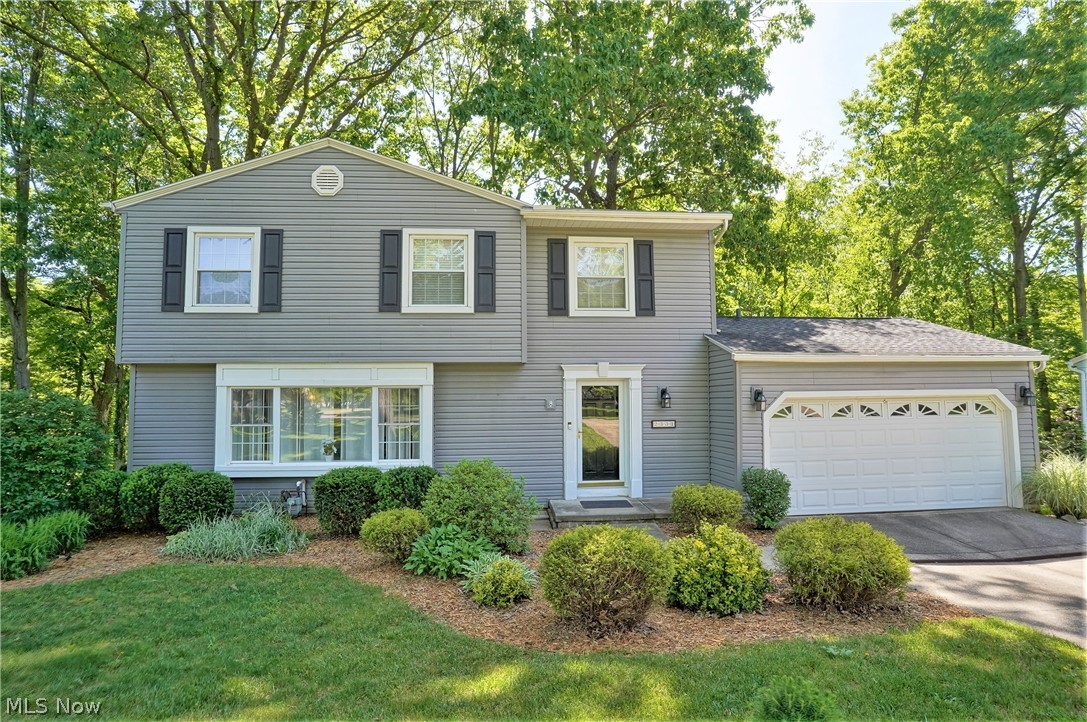WOW! a true 5 Bedroom Home adjacent Sand Run Park! This value packed home has too many features to mention. Located in a beautiful neighborhood, geographically, convenient to everything in Western Summit County! The back yard is literally a park setting with lush trees in a ravined setting. First Floor boasts Family Room to large Deck, large Formal Dining Room & Spacious Living Room with dramatic picture window. The Eat-In Kitchen features granite counters and plenty of storage. Lower level is a Walk out to park like yard and features family room and 1/2 bath, plus there's an enormous amount of storage in the unfinished areas.  All 5 bedrooms are on 2nd floor and there are 2 full baths. The master and front Bedroom have a Jack & Jill Bath, making many possibilities to expand master suite. Updates to the home in the past 14 years include Roof, Siding, granite counters , furnace and central air.