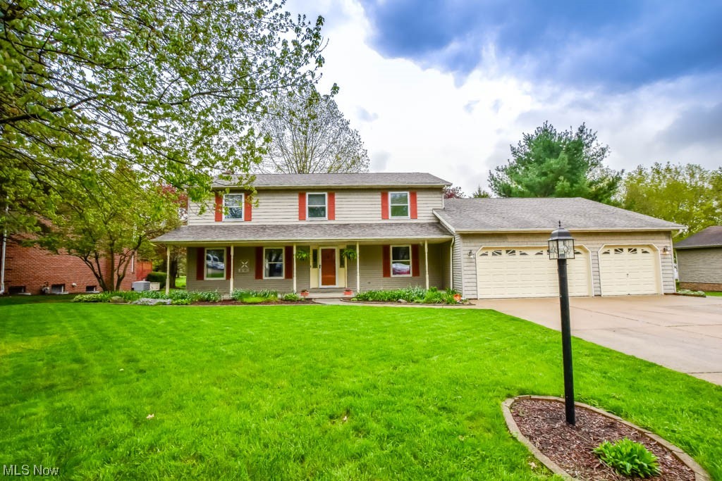 Don't miss your opportunity to see this spacious and well-maintained Norwood Hills gem! With over 3500 sqft of finished living space, there's plenty of room for everyday living as well as entertaining. The foyer entry leads to the formal living room and dining room complete with a chair rail and tray ceiling making it the perfect space for hosting holidays or dinner parties. Prepare meals in the massive eat-in kitchen boasting tons of cabinet space, a workstation, and a dinette for everyday meals. The adjacent family room is perfect for relaxing in front of the wood-burning fireplace flanked by built-in bookcases. In the hall leading to the attached 4 car garage, you'll find a convenient full bath and an oversized laundry room with a sewing table and built-in ironing board!  Upstairs offers four bedrooms and two full baths. The spacious master suite includes a private bath with an extended vanity, step-in shower, heated jetted tub, and a walk-in closet. The lower level adds a huge rec