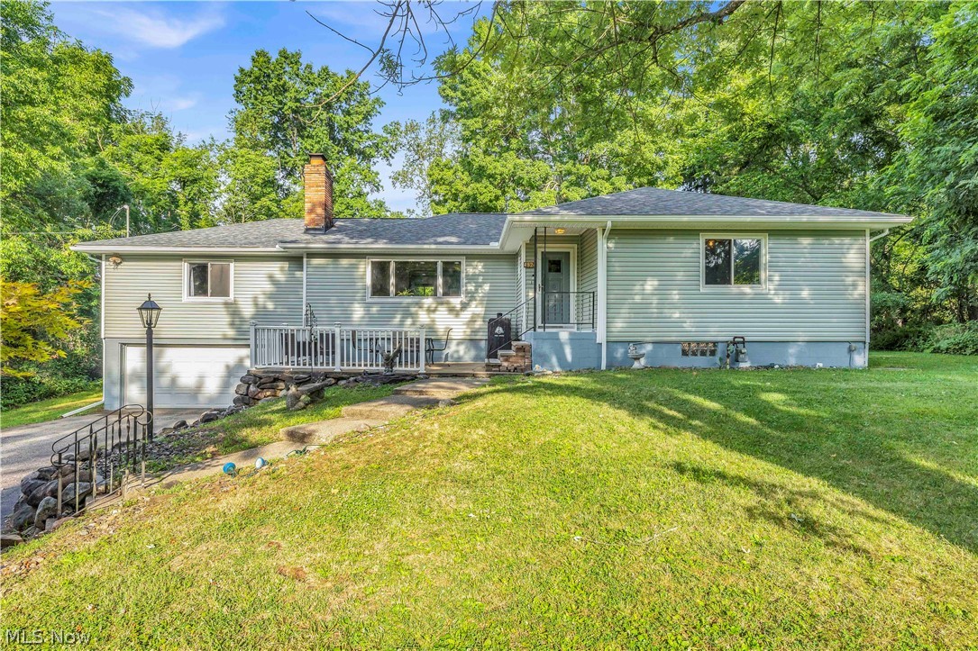 Situated on a rare 1.43-acre wooded lot set back on Darrow Road, this updated home offers high-end finishes and modern mechanicals. The kitchen features Amish custom maple cabinetry, granite countertops, mosaic tile backsplash, breakfast bar, deep stainless-steel sink, and a large skylight. Hardwood oak floors run through the spacious living room with fireplace. The main level includes a first-floor family room with cathedral ceilings and a second fireplace. Upstairs features 3 large bedrooms and an updated bath (2023), with a 4th bedroom on the lower level alongside a spacious rec room with bar. Outdoor features include a resurfaced back porch (2025) and a 40'x20' L-shaped deck overlooking private woods. Conveniently located between Akron and Cleveland, near CVNP hiking trails, shopping, Rt-8, I-77, and the Ohio Turnpike. Recent Updates: Roof, Siding & Gutters (2026), Back Porch (2025), Upstairs Bath (2023), Furnace (2023), Hot Water Tank (2016).