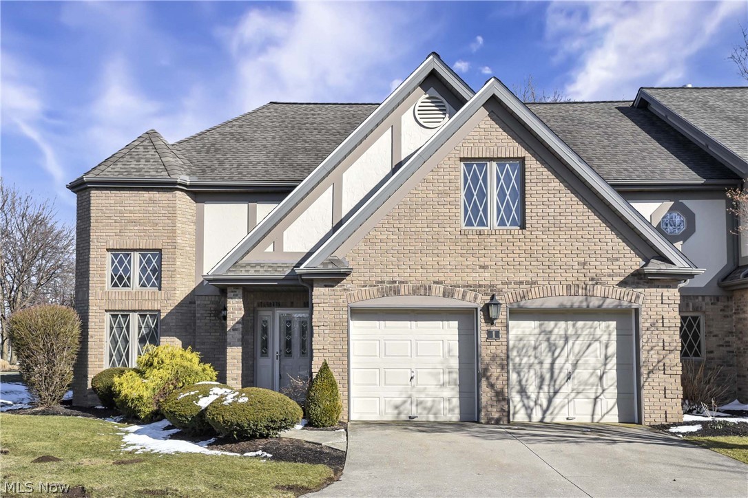 Soaring ceilings, sun-filled spaces, and convenient main-floor living make this beautifully maintained brick townhome a standout. From the moment you arrive, the charming architectural details and inviting curb appeal set the tone for what awaits inside. Step into the dramatic two-story great room featuring soaring ceilings, expansive windows, and a cozy fireplace the perfect setting for both everyday living and entertaining. The open staircase and loft overlook add architectural interest while providing flexible space ideal for a home office, media room, or guest retreat. The kitchen offers abundant cabinetry, generous counter space, and an adjoining breakfast nook filled with natural light from oversized windows, creating a warm and welcoming place to start your day. The main-floor primary suite features a full bath with both a soaking tub and separate shower, offering comfort and convenience. Two additional generously sized bedrooms are located on the second level, providing ample space for family, guests, or flexible use. Neutral finishes and plush carpeting provide a move-in ready canvas for your personal style. Enjoy outdoor relaxation on the private rear patio, complete with a striking chimney backdrop and landscaped surroundings. With a two-car attached garage, spacious layout, and thoughtful design throughout, this home blends comfort, functionality, and classic appeal in a desirable setting. One-year HSA Home Warranty provided. Roof replaced in 2016. Newer appliances, including 2023 washer and dryer. Conveniently located within walking distance to shops, dining, and everyday conveniences.
