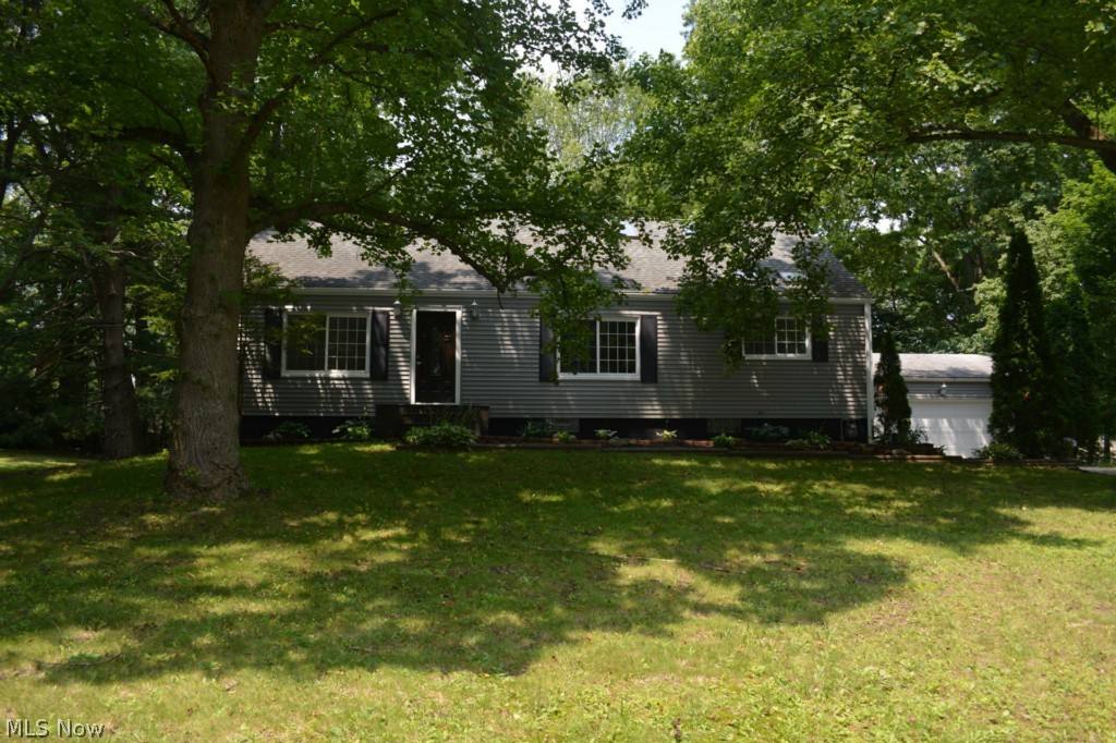 3722 Seneca St., Stow, OH 44224; Looking for plenty of room, nice yard, and all the work is done for you? LOOK NO FURTHER! This amazing Cape Cod is on a quiet dead end street with a huge treed yard with plenty of room for family activities.  Every room in the house has been redone.  Check out the photos! Starting at the beautiful front entry door, this home features new trim, paint, flooring, and fixtures just about everywhere! The living and dining rooms feature tastefully re-done hardwood floors with a rich, dark finish. The kitchen is first class with new cabinetry, granite counter tops, beautiful ceramic tile floor, and new paint and trim. A bonus room off the kitchen, the "sun room", can be used as a breakfast area or an office/library. Both full baths are completely re-done and well appointed and feature new fixtures and ceramic tile floors. All the bedrooms are fresh with new paint, trim, and carpet.  Upstairs could be a private owner's suite with a huge bedroom, beautiful en su