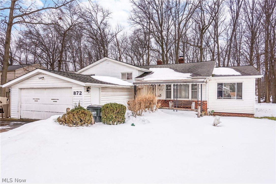 Priced for updates needed. Loads of space and possibilities on this .38 of an acre parcel!  Located at the end of a quiet dead-end street.  Huge Eat-In Kitchen with tall solid oak cabinets, Corian counters, stainless Sink, Fridge & Microwave. Very large pantry. Built-In Island with storage and large Corian counter for bar stools. Two sets of French doors in the kitchen, one to the Living Room the second to the Family room.   Living room with wood-burning fireplace.  Family room with a cast-iron stove & sliding door to go out to the XL double parcel!  Hardwood flooring under the carpeting in the living room, all 4 bedrooms, and the bedroom hallway.
All bedrooms have ceiling fans.  Lower level is a walk-out with a full bath. Electrical Panel updated. Loads of storage.  Do you need a workshop & storage for an extra car – we have you covered! Full 2 car detached garage with a single garage door for access.  This detached garage also has a staircase for access to storage above.  There is a