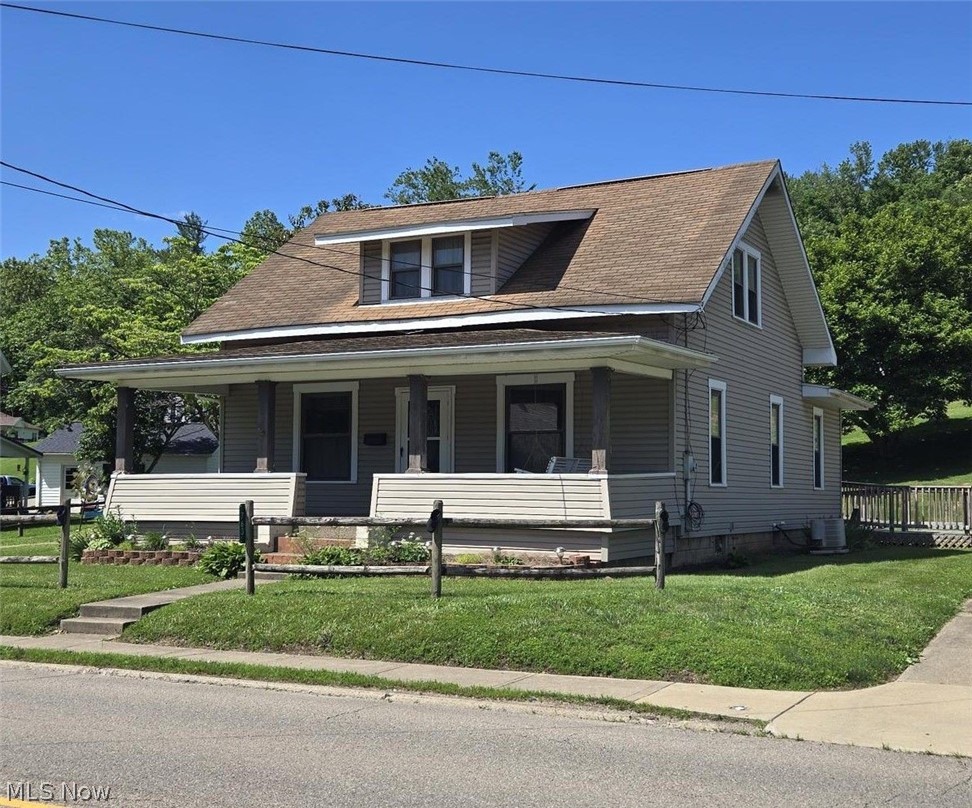 Nestled in a prime in-town location, this charming one and a half story home offers both convenience and comfort. With three cozy bedrooms and a single full bath, it's perfect for family living. Step into the newer oak kitchen where all the appliances are included, making meal prep a breeze. The home features convenient accessibility with a rear handicap ramp and boasts a one car detached garage with extra storage space. Enjoy the maintenance free vinyl siding and energy efficient thermopane windows. A large dining room and a convenient first floor bedroom round out this delightful home.