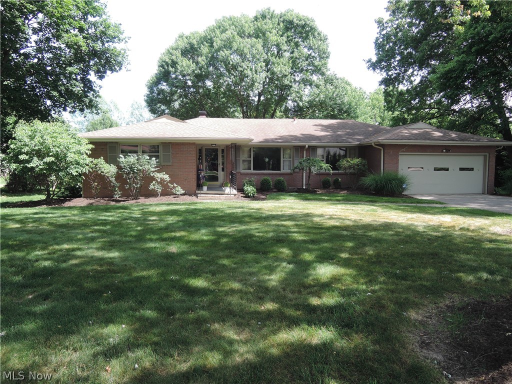 Welcome to this charming, quality built, all brick ranch located on a dead end street in a neighborhood of lovely homes.  Features include a large eat-in kitchen offering all appliances, newer flooring, lots of storage, pantry and easy access to the first floor laundry (washer/dryer stay), half bath and first floor office; spacious  living room and dining room (table and chairs can stay) with crown moldings, cozy family room with gas fireplace opens to a 4-season Florida room with vaulted ceiling, shelving and overlooking the patio and backyard. The master bedroom has an updated bath with shower and small soak tub and a large closet.  Two additional bedrooms and full bath complete the first floor. The full basement has been recently waterproofed (2025 by Ka-Ron) with a transferable warranty; sump pump and new glass block windows; boiler new in 2017. The window A/C's will stay and many household items are negotiable. Over half acre lot with scenic backyard.   A Home Warranty is included.  Don't miss the opportunity to make this one yours!