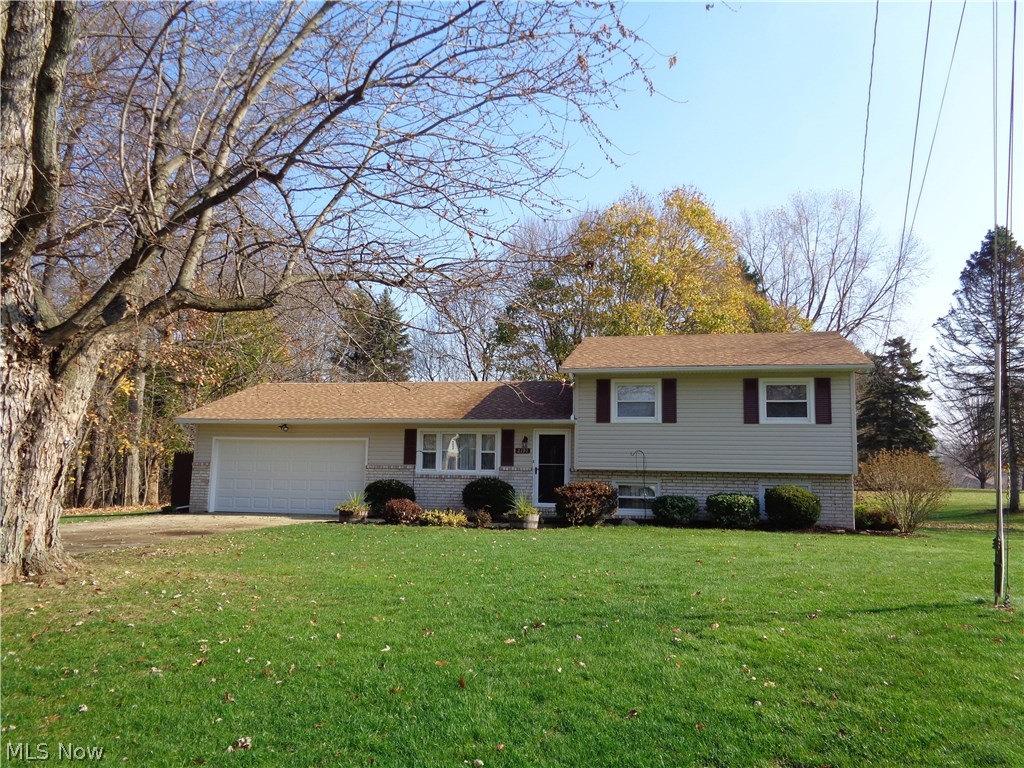Wonderful split level in Lake Schools district.  Landscaped large yard with plant drip system, a private patio, storage shed, and located in a cul de sac.  Three bedrooms, master bedroom with 1/2 bath, and 2 more nice bedrooms with great closets.  Living room has large quest closet.  Kitchen has stove, refrigerator, dishwasher, microwave and newer faced hickory front cabinets and a built in desk. Lower level with large family room, also a room that could be office/playroom etc and utility room with washer and dryer. Many updates throughout the home.  Roof, siding, and front door 2014.  Furnace and central air 2007.  Ready to move in.