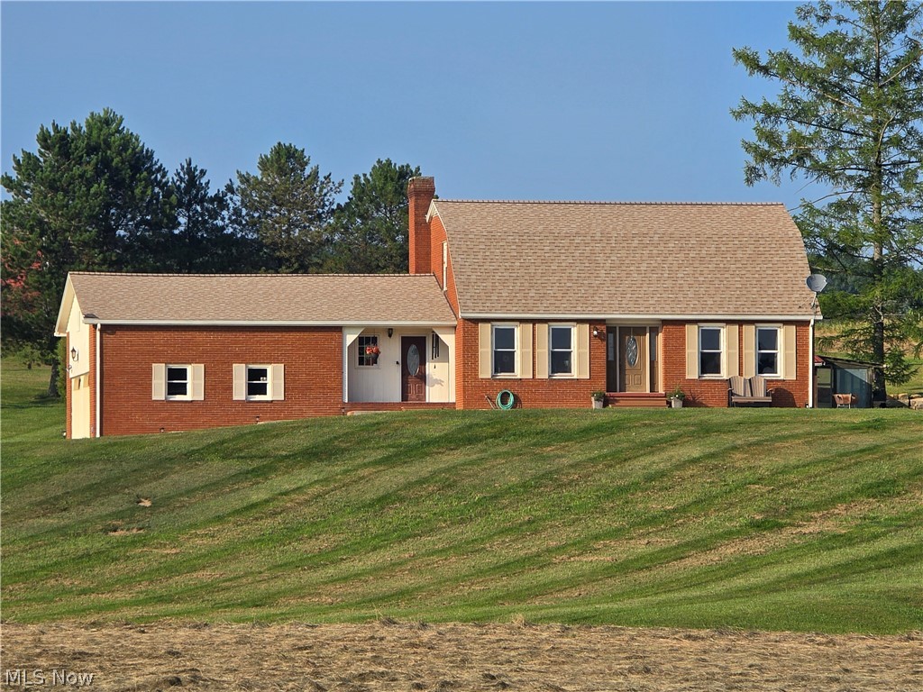 Country Living with Character, Space, & Stunning Views! Welcome home to this beautiful brick country retreat nestled on 2.8 picturesque acres with breathtaking views of the surrounding countryside. Combining timeless charm with thoughtful updates, this one-of-a-kind property offers the perfect blend of comfort, history, and peaceful rural living. Step inside the inviting foyer, featuring original doors from the historic Coshocton County Jail on Main Street, adding a truly distinctive touch you won't find anywhere else. The spacious main level offers an ideal layout for both everyday living and entertaining, including a large dining area, a gorgeous kitchen, nice large living room, a private home office, and a full bathroom complete with a walk-in shower and convenient first-floor laundry. Upstairs, you'll find three comfortable bedrooms and a second full bathroom, providing plenty of room for family or guests.
Outside, enjoy your own private oasis. Relax on the peaceful deck, unwind beside the tranquil fishpond, or take advantage of the 16' x 24' detached bonus building—perfect for a workshop, hobby space, or extra storage. An attached two-car garage completes this exceptional property. If you've been searching for a home with character, acreage, and unforgettable views, this country gem is one you won't want to miss! Call today for a private tour!