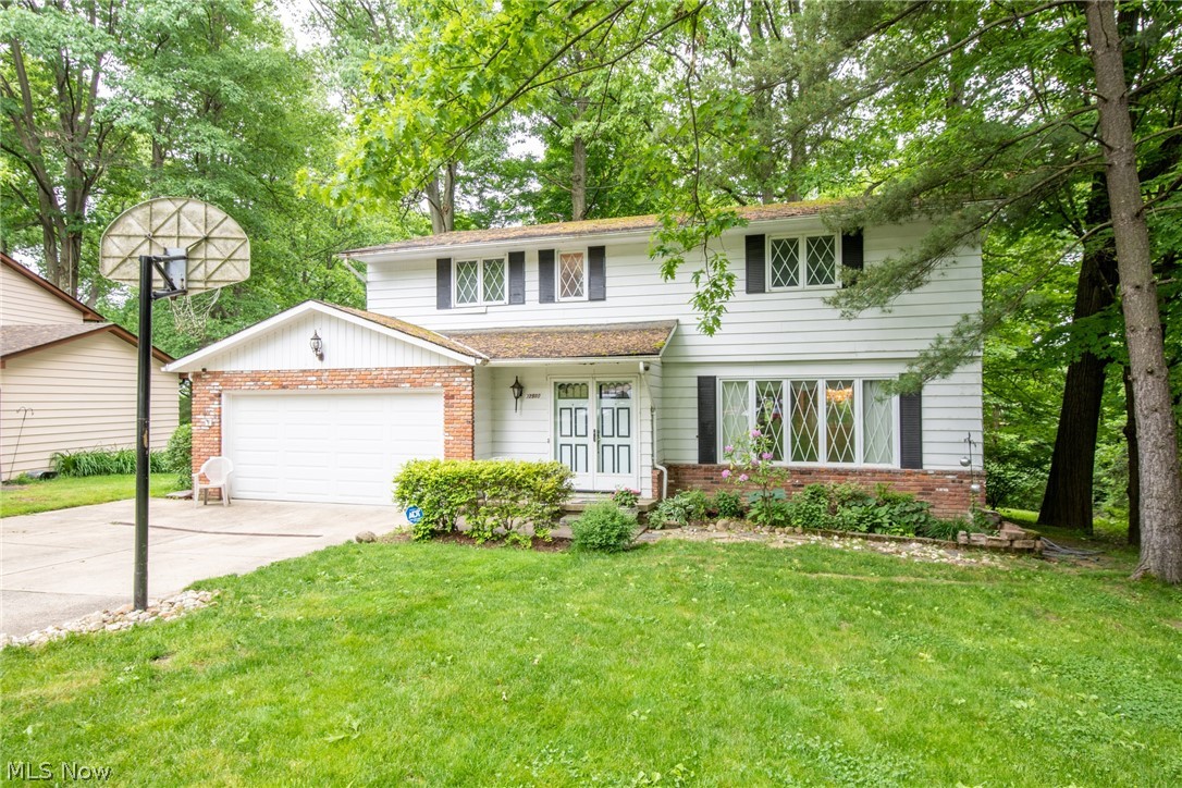 Motivated seller! Don't miss this opportunity to make this beautiful home your own!  4-bedroom, 3.5-bathroom colonial tucked away on a quiet street and wooded lot in beautiful North Solon. Enter through the front door and into the soaring two-story foyer, with a generous living room on your right where a wall of windows lets in plenty of natural light. Continue into the formal dining room with built-in corner cabinetry and through to the large kitchen that offers plenty of counter and cupboard space, as well as an informal eat-in area. Glass sliders take you outside onto the newer deck with a stunning view of the wooded yard beyond where wildlife and native plants are abundant, perfect for relaxing or entertaining outdoors! Also located off the kitchen is the cozy family room with a fireplace and secondary sliders to the deck for more beautiful views and natural light. The main floor is complete with a powder room and access to the attached two-car garage. The second floor offers newer