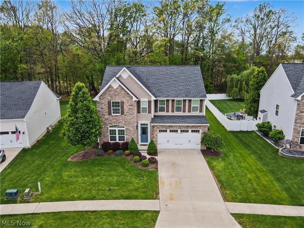 This beautifully maintained 3-bedroom, 2 full bath and 2 half bath home in the highly desirable Cranberry Creek community! Built in 2014, this spacious property offers over 2,300 sq ft of thoughtfully designed living space, perfect for both everyday living and entertaining. The open-concept layout features a well-appointed kitchen with ample cabinetry and generous prep space, seamlessly flowing into the dining and living areas—complete with a cozy fireplace that creates a warm, inviting atmosphere.
Upstairs, you’ll find generously sized bedrooms, including a spacious owner’s suite with a private bath and walk-in closet.
Enjoy year-round comfort with central air and the convenience of an attached heated garage. Step outside to a beautiful wooded lot featuring a paver patio and gas fire pit—ideal for relaxing evenings or hosting guests.Conveniently located near shopping, dining, parks, and major highways, this move-in ready home is the perfect blend of comfort, style, and location.