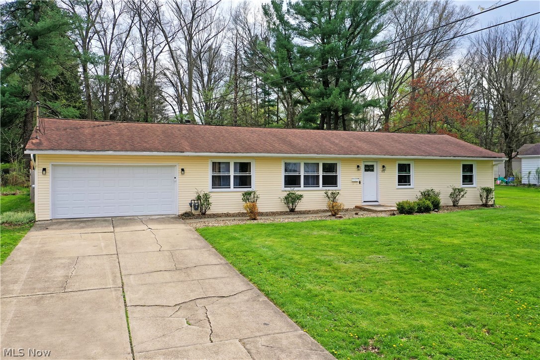 *Back on the market due to no fault of the home* Masterfully updated and filled with sleek, modern design elements; this must-see Boardman ranch has all the right moves and then some! This gorgeous three-bedroom residence is everything you’ve been looking for, all wrapped up in an attractive package. Instantly endearing, the bright colors and clean, stone trimmed landscaping provide tons of curb appeal, all while the cement driveway leads up towards the two-car attached garage. A fenced-in backyard adds to the allure, offering both a sizeable rear patio and a bonus storage shed. Step inside to be met with a welcoming living room. Soft, natural light filters through the row of windows to create a calm and relaxing environment. Underfoot, hardwood styled flooring adds to the warmth with durable good looks. Around the corner, take in the views from the formal dining room, enjoying instant backyard access as it overlooks the gorgeous kitchen with its tiled backsplash, additional bar top seating and faux-stone countertops. Laundry service resides near garage access. Meanwhile, the main hall continues past a remarkable full bath with a stunning dual vanity and matching tiled shower with tub. Each of the three bedrooms showcase bright and inviting living space with tall windows. The master suite completes the package with its larger footprint and elaborate full private bath with its glass door shower.