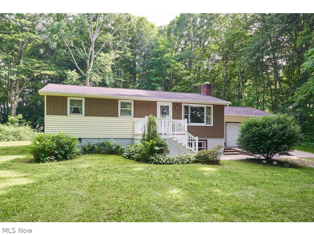 Welcome to 19079 Burkhart Rd! This 3 bedroom, 2 bathroom raised ranch has been well maintained and sits on just under 1.5 Acres!  The spacious living room flows right into the dining area and kitchen which has plenty of cabinet and counter space. Sliding door off of dining leads you to the patio in the private backyard, perfect for entertaining! Down the hall you will find the three spacious bedrooms along with the full bathroom. All of this with an attached two car garage! Call today to schedule your private showing!