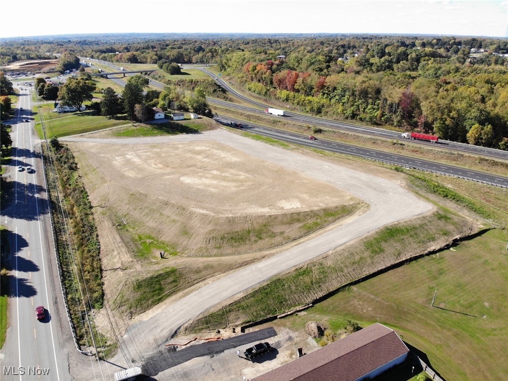 LOCATION! LOCATION! LOCATION! This incredible lot is cleared and ready for your business! Offering excellent visibility from Interstate 70 (East and West exposure) and two approved access points from State Route 40, this property is primed for high traffic and easy accessibility. Conveniently located just minutes from the interstate—between the Adamsville and Airport exits—and in close proximity to three major business parks: Airport Business Park, East Pointe Business Park, and National Road Business Park. A prime commercial opportunity in a rapidly growing corridor!